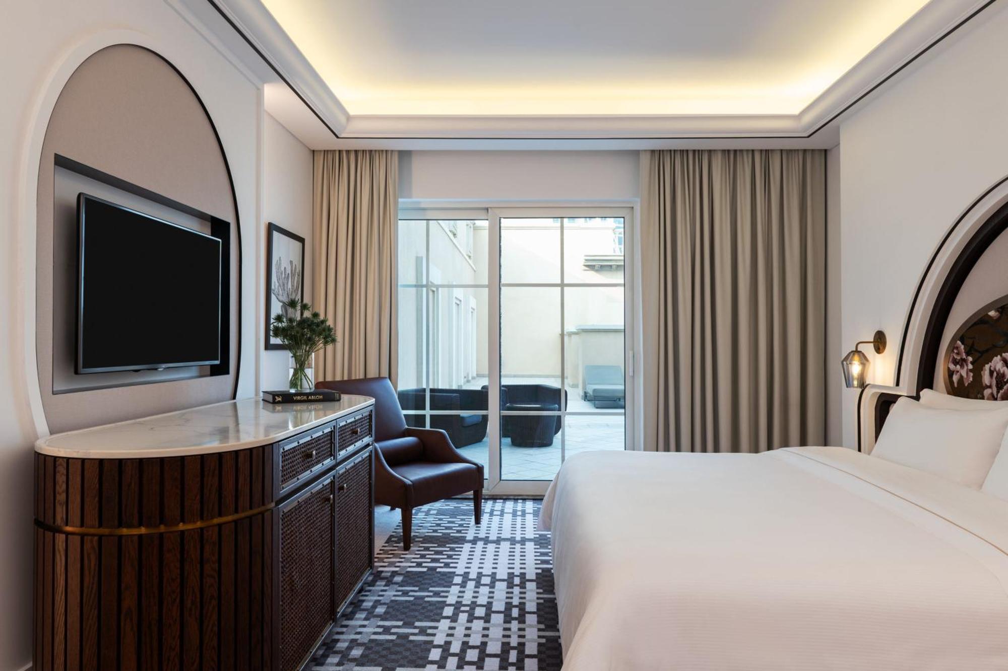Deluxe Suite Sea View, 1 King bed with Balcony, separate living room with Sofa bed, Breakfast, Dubai Airport Transfers, & Jungle Bay Waterpark access